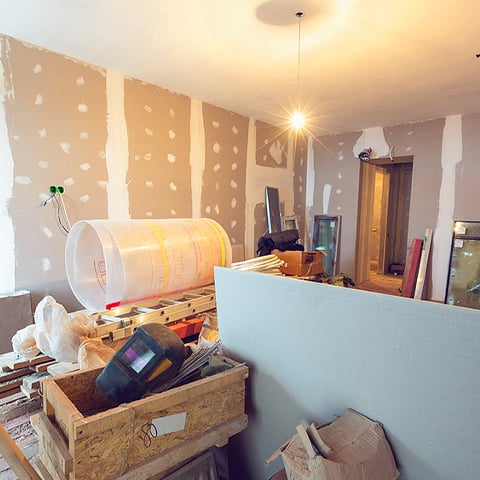 Home improvement projects like this unfinished room with tools is possible with a heloc.