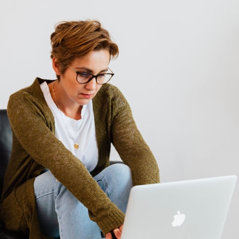 thoughtful woman typing