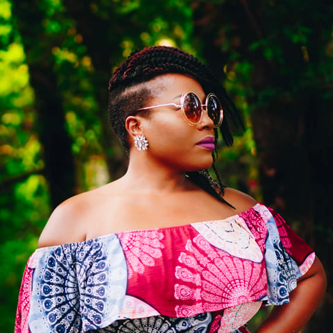 African American woman wearing sunglasses looking to her right