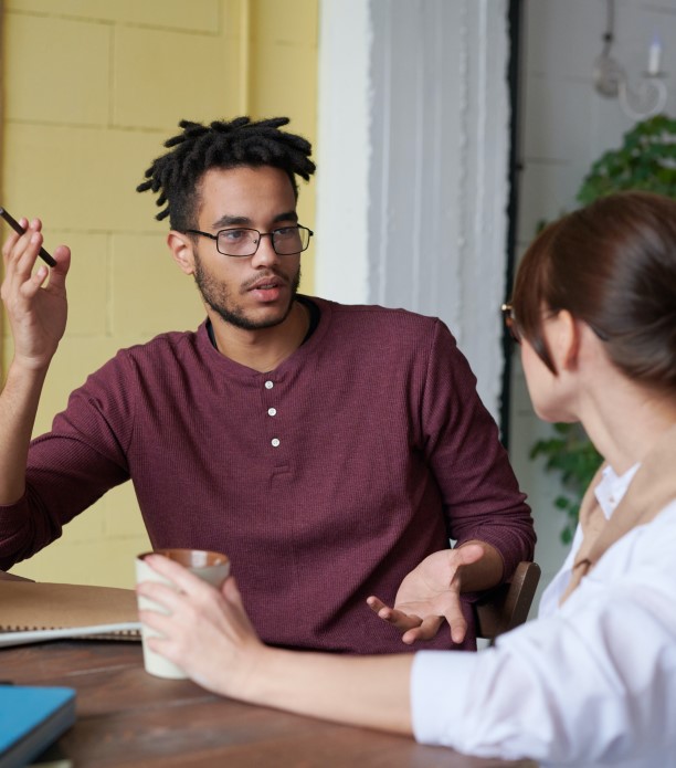 Man and woman talking about money management