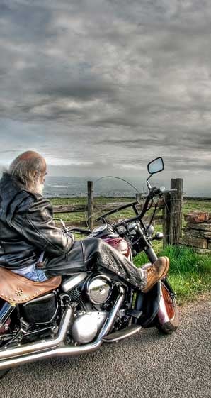 a-motorcycle-loan-is-affordable-with-allegiance-credit-union-older-man-sitting-on-his-motorcycle
