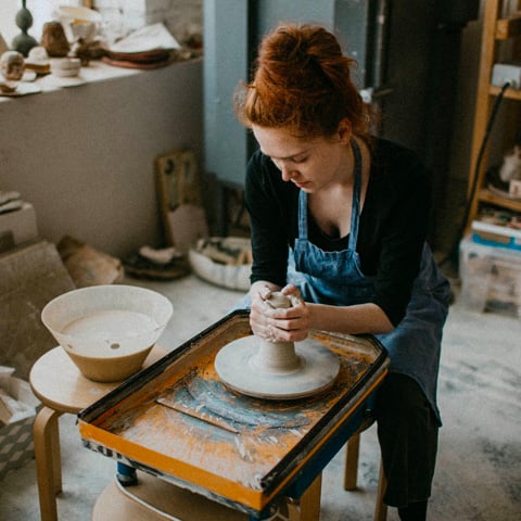 Low Personal Loan rates helped this woman afford her new pottery sculpting hobby.