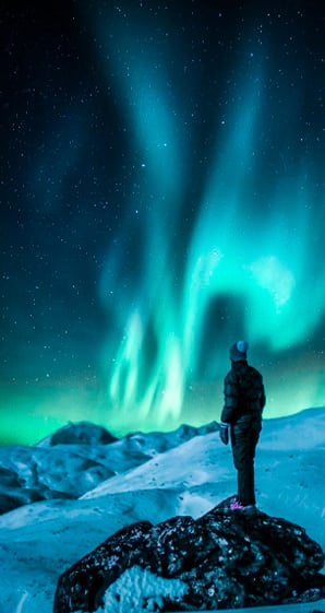 man standing near snowfield