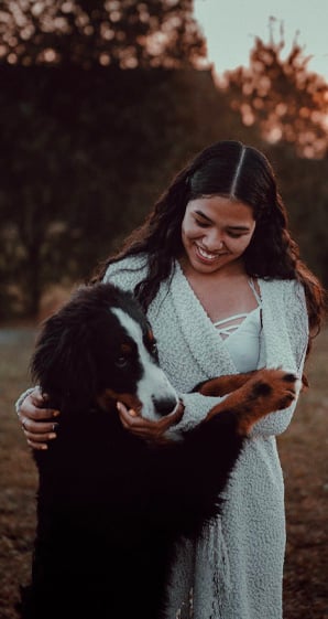 woman petting dog