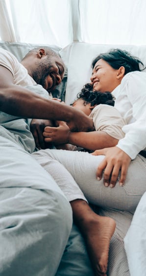 happy family in bed