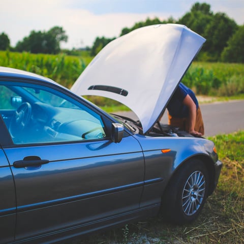 person repairing car