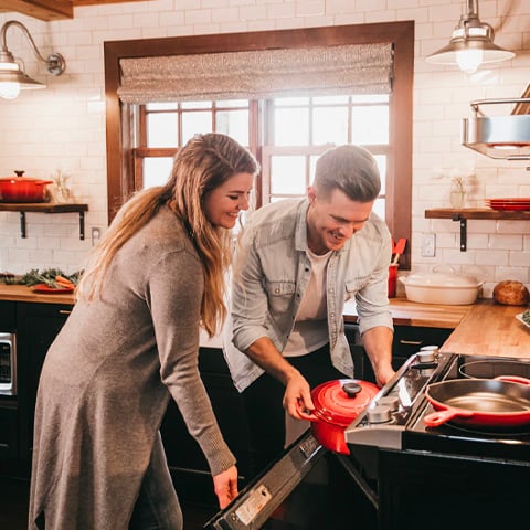 man and woman cooking